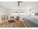Main bedroom features ceiling fan, large windows, and natural light at 400 S Gilpin St, Denver, CO 80209