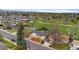 An aerial view of a well-manicured home with a charming yard, mature trees and quiet street at 1155 W 4Th Ave, Broomfield, CO 80020