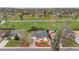 A picturesque aerial view of the home, showcasing lush landscaping and mature trees at 1155 W 4Th Ave, Broomfield, CO 80020
