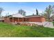 Large backyard featuring a patio and partial rock landscaping at 1155 W 4Th Ave, Broomfield, CO 80020