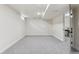 Spacious finished basement area with neutral carpet, white walls, and a doorway to another room at 1155 W 4Th Ave, Broomfield, CO 80020
