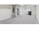 Spacious basement area with neutral paint and plush carpeting at 1155 W 4Th Ave, Broomfield, CO 80020