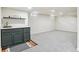 Finished basement featuring carpeting, a stylish bar with marble counters and storage at 1155 W 4Th Ave, Broomfield, CO 80020