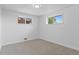 Bright empty bedroom with plush carpet, offering a blank canvas for personalization and comfort at 1155 W 4Th Ave, Broomfield, CO 80020