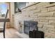 Modern fireplace with attractive stone surround and black metal accents creates a warm and inviting focal point at 1155 W 4Th Ave, Broomfield, CO 80020