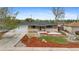 Charming front yard and home with stone accents, manicured lawn and mature tree at 1155 W 4Th Ave, Broomfield, CO 80020
