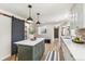 Stylish kitchen featuring an island with pendant lighting and modern design elements at 1155 W 4Th Ave, Broomfield, CO 80020