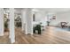 Bright living room with hardwood floors, fresh paint, and a view into an updated kitchen at 1155 W 4Th Ave, Broomfield, CO 80020