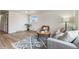 Cozy living room with bright window, comfortable seating, and stylish rug at 1155 W 4Th Ave, Broomfield, CO 80020