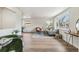 Bright living room featuring hardwood floors, large windows, and neutral decor creates a welcoming atmosphere at 1155 W 4Th Ave, Broomfield, CO 80020