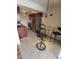 Open concept dining and kitchen area with stainless steel appliances, modern table and chairs, and tile floors at 1021 Carr St # 37, Lakewood, CO 80214
