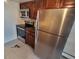 Remodeled kitchen with stainless steel appliances, wooden cabinetry, and lots of counter space at 1021 Carr St # 37, Lakewood, CO 80214