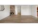 Inviting living room featuring a brick fireplace and modern flooring for a cozy ambiance at 1021 Carr St # 37, Lakewood, CO 80214