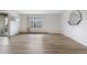 Inviting living area featuring hardwood floors, radiator heat, and a large picture window at 1021 Carr St # 37, Lakewood, CO 80214