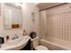 Bathroom featuring a tub/shower combination with white subway tile and a modern sink at 634 S Hazel Ct, Denver, CO 80219