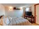 Bedroom with a comfortable bed, side table, and a window, creating a relaxing retreat at 634 S Hazel Ct, Denver, CO 80219