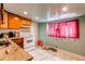 Kitchen area with essential appliances and a window, offering a practical cooking space at 634 S Hazel Ct, Denver, CO 80219