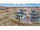 Aerial view of a modern two-story home featuring a spacious yard and situated in a Gathering-friendly neighborhood at 555 Coal Bank Trl, Castle Rock, CO 80104