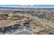 An aerial view shows the home's prime location within a growing community near roadways and the surrounding countryside at 555 Coal Bank Trl, Castle Rock, CO 80104