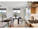 Dining room with stunning view and seamlessly connected to the kitchen and the outdoors at 555 Coal Bank Trl, Castle Rock, CO 80104