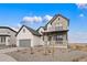 Charming two-story home featuring a two-car garage, landscaped yard, and inviting front porch perfect for relaxing at 555 Coal Bank Trl, Castle Rock, CO 80104