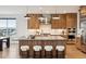 Modern kitchen with a large center island, stylish lighting, and state-of-the-art appliances at 555 Coal Bank Trl, Castle Rock, CO 80104