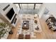 Open-concept living room with a fireplace, soaring ceilings and oversized windows with views at 555 Coal Bank Trl, Castle Rock, CO 80104