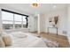 Bright main bedroom featuring a large window with scenic views and modern decor at 555 Coal Bank Trl, Castle Rock, CO 80104