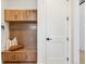Functional mudroom with a wooden bench, storage cabinets, and decorative pillows at 555 Coal Bank Trl, Castle Rock, CO 80104