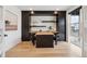 A stylish office offers built-in shelving, ample natural light, and modern decor at 555 Coal Bank Trl, Castle Rock, CO 80104