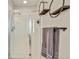 Bathroom featuring a shower with glass door and unique industrial style shelving at 226 N Millbrook St, Aurora, CO 80018