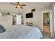 Bedroom featuring a TV, and an attached bathroom at 226 N Millbrook St, Aurora, CO 80018