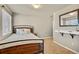 Bedroom featuring carpeted floors, natural light, and a mirror on the wall at 226 N Millbrook St, Aurora, CO 80018