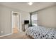 Bedroom with carpeted floors, natural light, and a view to the entrance hall at 226 N Millbrook St, Aurora, CO 80018