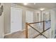 Hallway showcasing carpeted floors and access to various rooms on the upper level at 226 N Millbrook St, Aurora, CO 80018