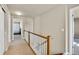 Upstairs hallway showing natural light and carpet flooring at 226 N Millbrook St, Aurora, CO 80018