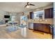 Kitchen showcasing stainless steel appliances, dark wood cabinets, and an island with barstool seating at 226 N Millbrook St, Aurora, CO 80018