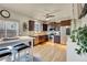 Charming kitchen featuring stainless steel appliances, dark wood cabinetry, and hardwood floors at 226 N Millbrook St, Aurora, CO 80018