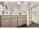 Beautiful bathroom with dual sinks, modern fixtures, and a walk-in shower at 7024 Kali Ct, Frederick, CO 80530