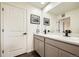 Well-lit bathroom featuring dual sinks, sleek fixtures, and ample counter space at 7024 Kali Ct, Frederick, CO 80530