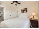 Comfortable bedroom featuring a ceiling fan, neutral colors, and a cozy atmosphere at 7024 Kali Ct, Frederick, CO 80530
