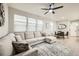 Spacious open-concept living room with comfortable seating and an adjacent dining area at 7024 Kali Ct, Frederick, CO 80530