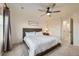 Comfortable main bedroom featuring a ceiling fan, a neutral color palette, and plenty of space at 7024 Kali Ct, Frederick, CO 80530
