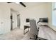 Bright office with a workspace, neutral carpet, and a comfortable, modern chair at 7024 Kali Ct, Frederick, CO 80530