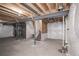 Unfinished basement with exposed utilities and staircase at 17600 Rose Heath Ln, Parker, CO 80134