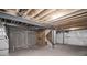 Unfinished basement with exposed ceiling, concrete floors, and visible utilities, offering potential for customization at 17600 Rose Heath Ln, Parker, CO 80134
