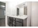 Bathroom featuring a double vanity with marble countertops at 17600 Rose Heath Ln, Parker, CO 80134