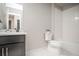 Bathroom featuring a vanity, toilet, and tiled shower-tub combination at 17600 Rose Heath Ln, Parker, CO 80134