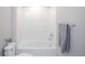 Bathroom featuring a tiled shower-tub combination and gray towel at 17600 Rose Heath Ln, Parker, CO 80134