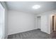 Bedroom with neutral colored walls, gray carpet, and a closet at 17600 Rose Heath Ln, Parker, CO 80134